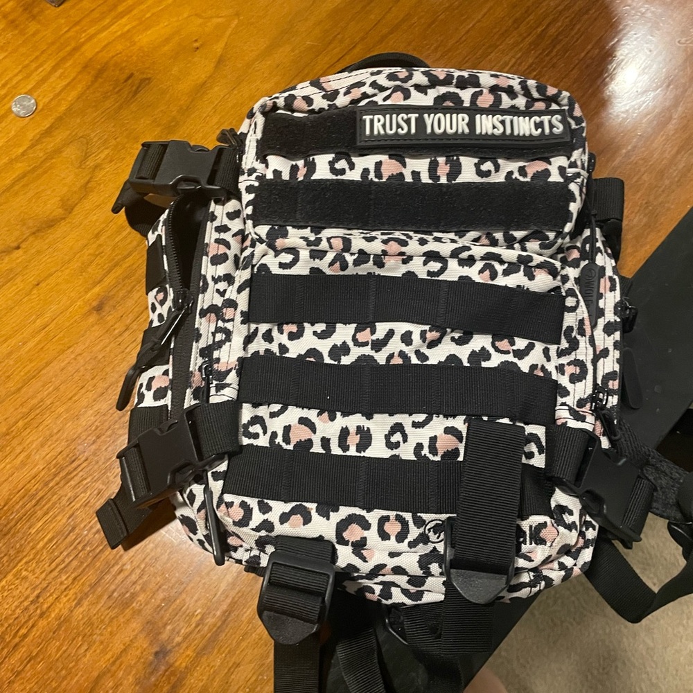 Wolfpak Leopard Print 9LBackpack with Trust Your Instincts Patch